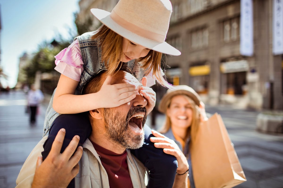 Close up of a Young family shopping in the city