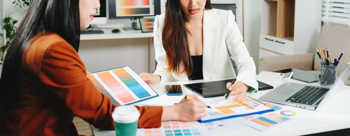 Designer showing website mockup to client